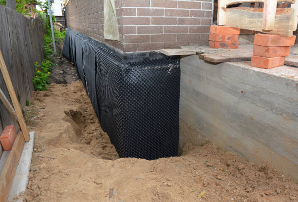 Happy homeowners after waterproofing job in Blue Bell